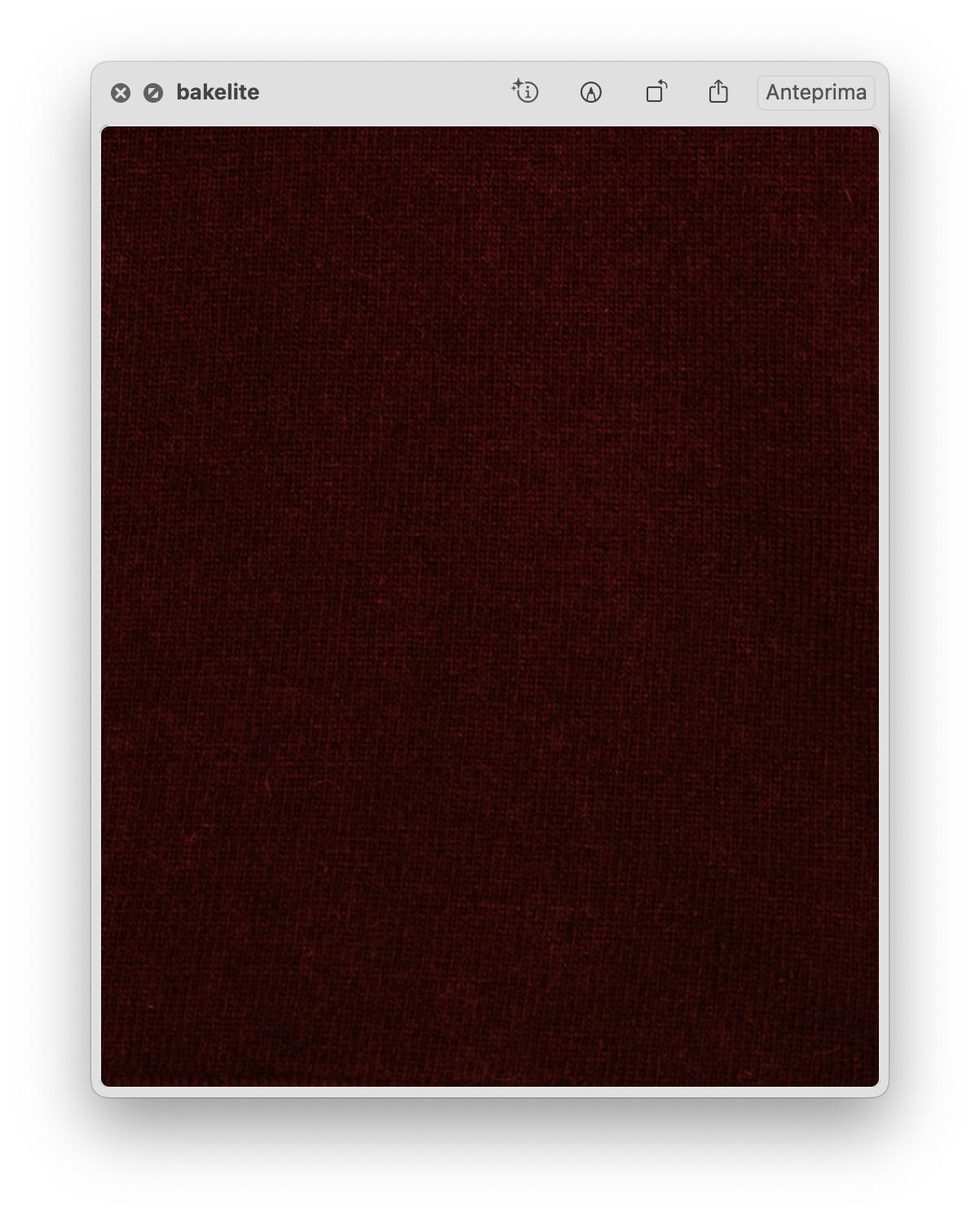 Close up of deep burgundy knit fabric texture.