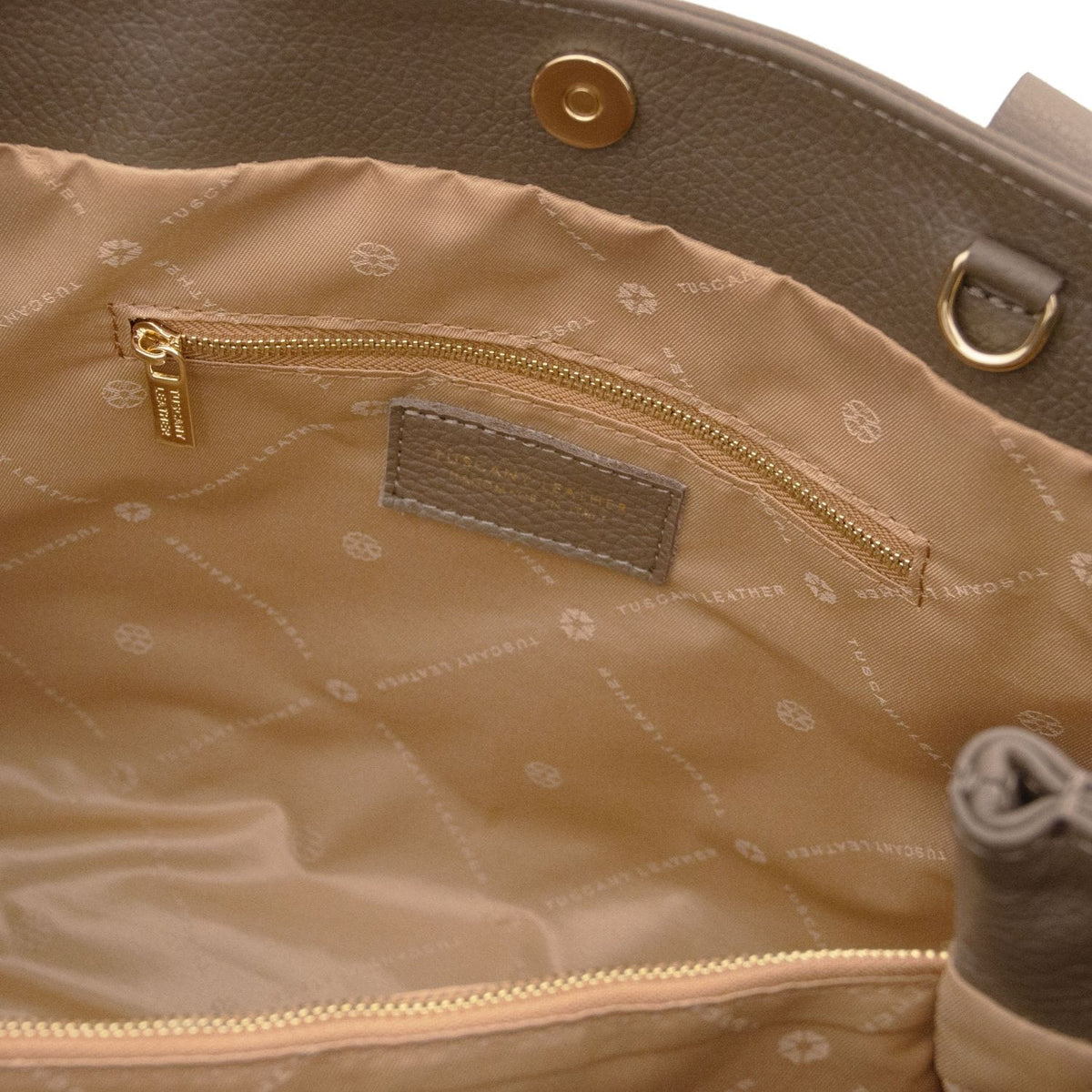 Tan interior of Callie soft leather shoulder bag with zip pocket and label patch