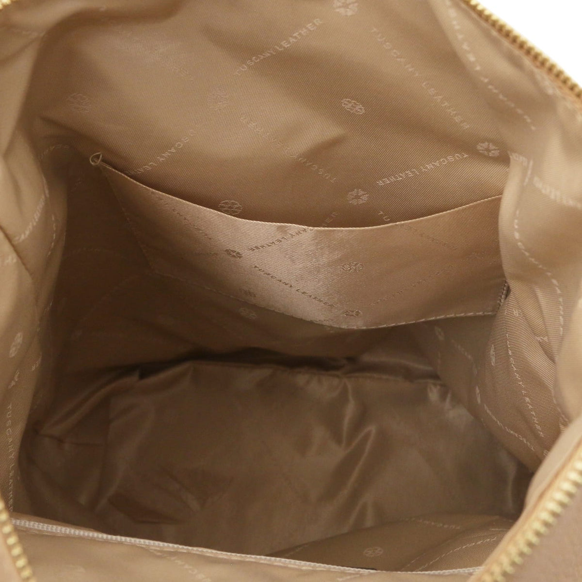 Interior view of Dublin soft Italian leather backpack in light tan lining with a pocket.
