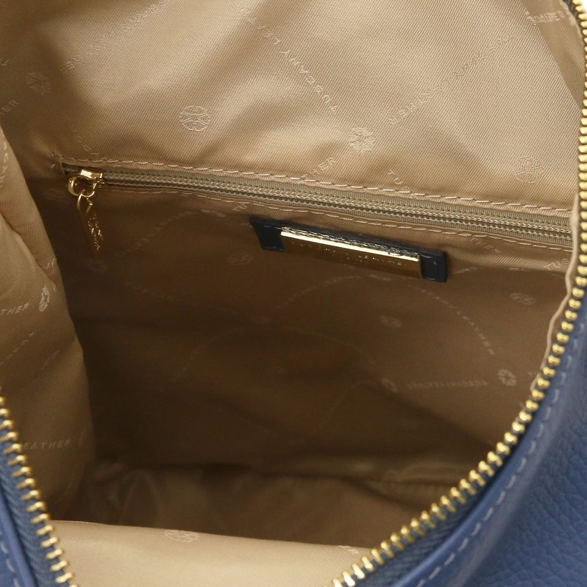 Beige interior of Dublin leather backpack with a zip pocket and gold zipper pull