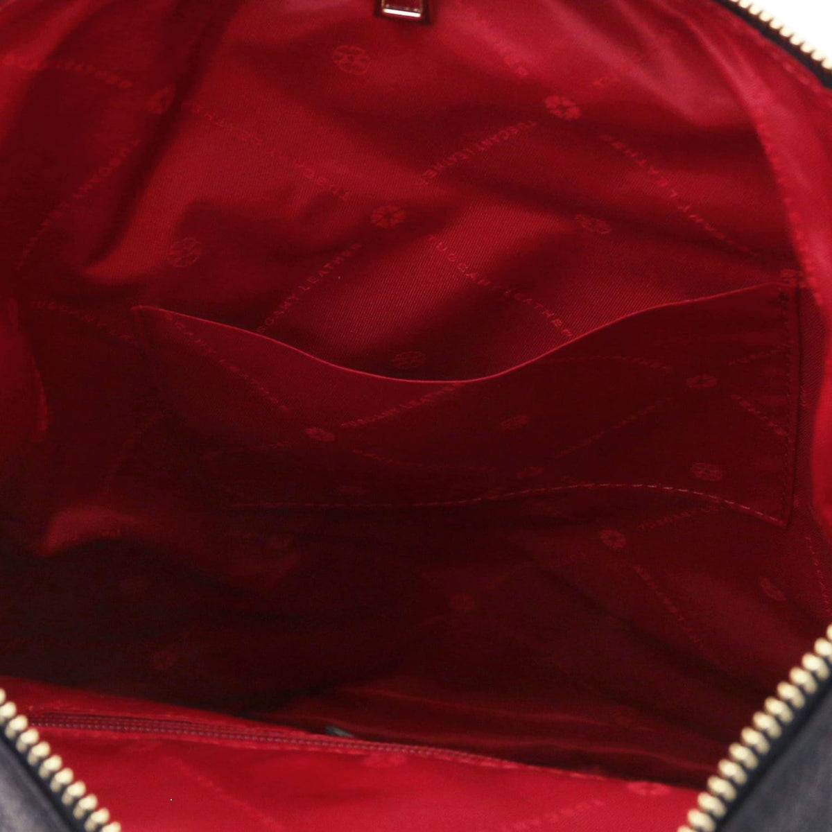 Red lining and curved interior pocket inside the Dublin soft Italian leather backpack