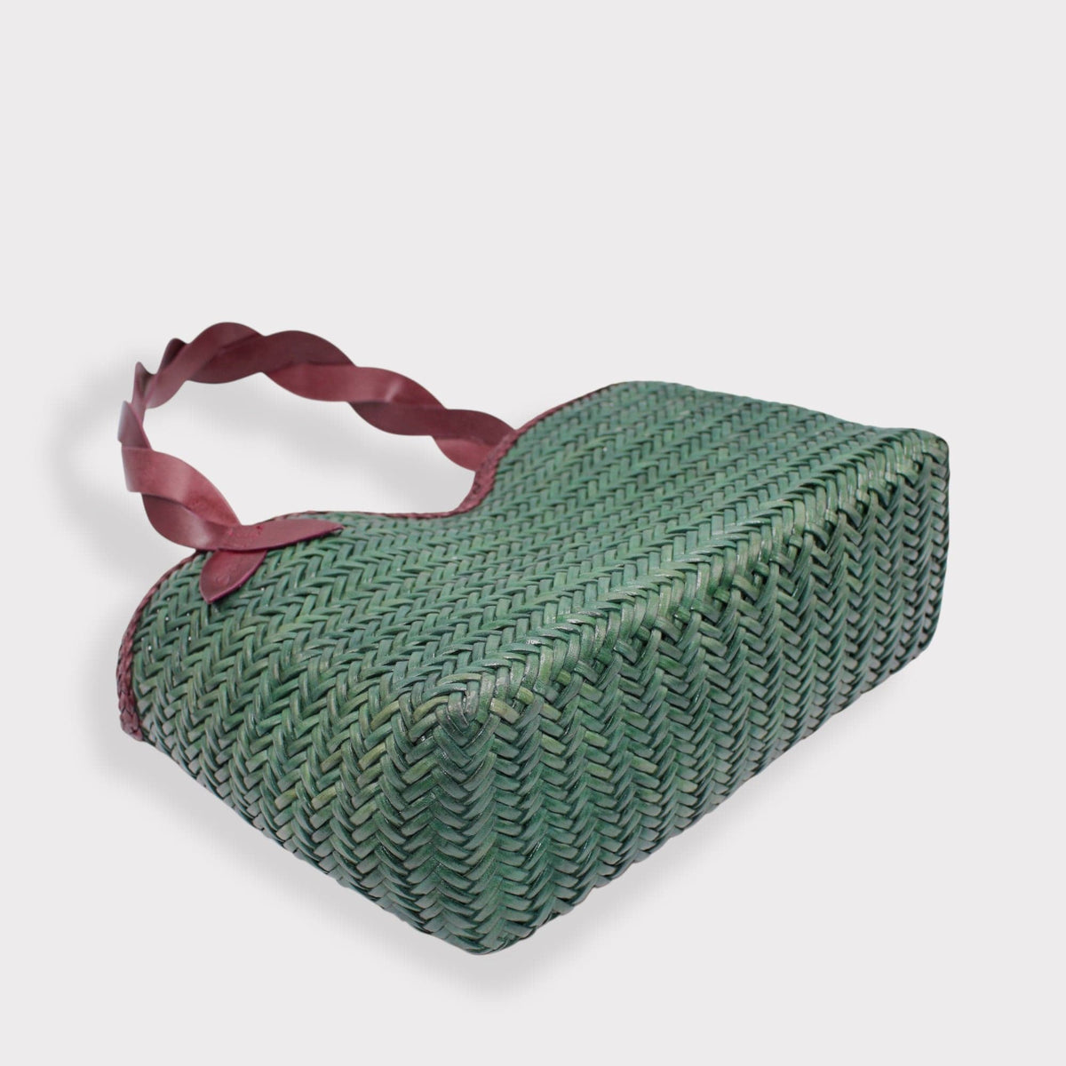 Léafa - Handwoven Leather Shoulder Bag | Burgundy & Green featuring woven green leather body with burgundy twisted leather handles and smooth trim.