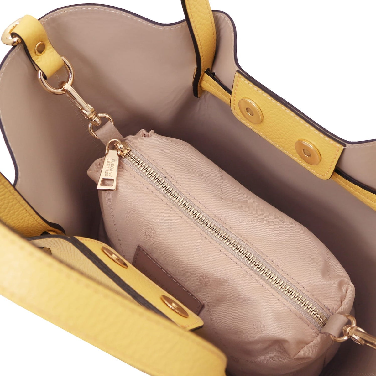 Interior view of Legame small handbag showing beige lining and a beige zip pouch inside.