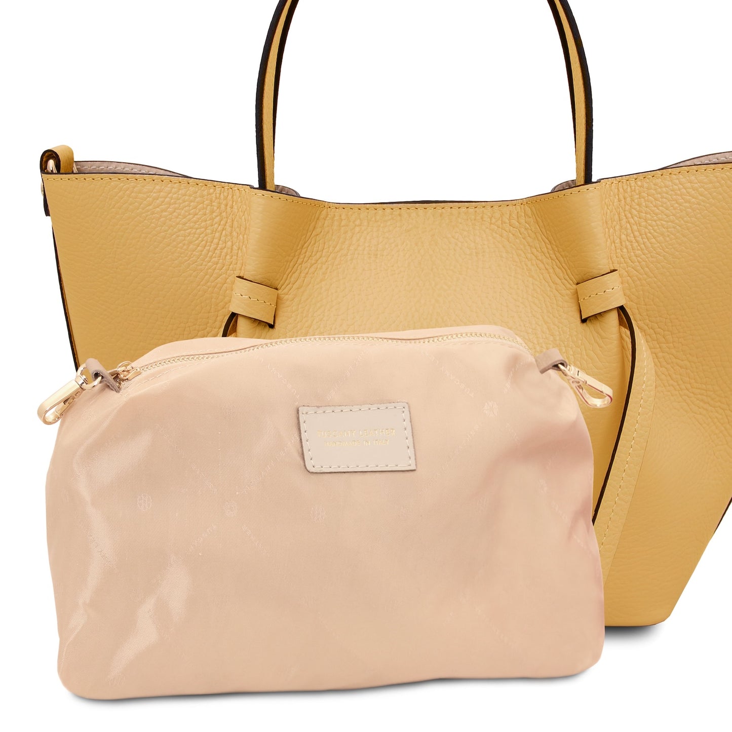 Front view of Legame small yellow leather handbag with beige trim and a beige pouch inside.