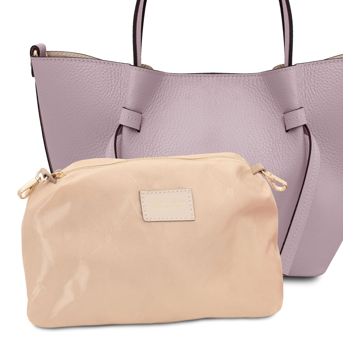 Lavender Legame leather handbag with top handles and a beige zip pouch placed in front.