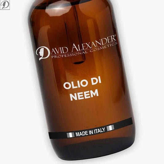 Tilted amber Neem oil bottle close up showing Olio di Neem label