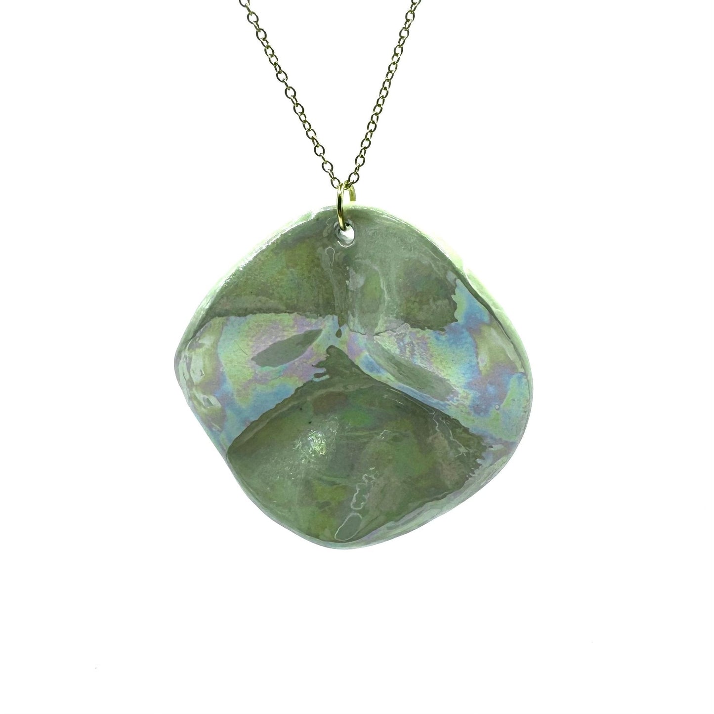 Sage green iridescent ceramic pendant necklace on a brass chain
