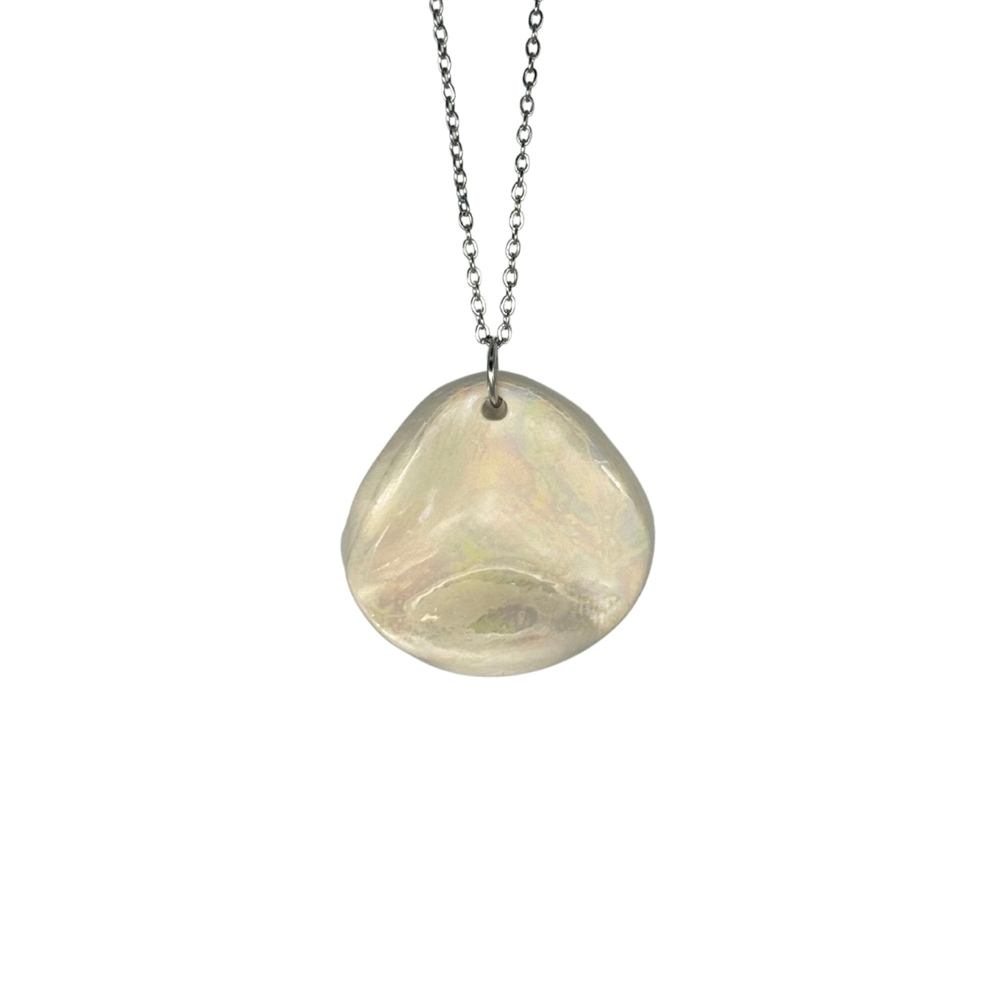 Pearl white ceramic pendant on a silver chain photographed against a white background.