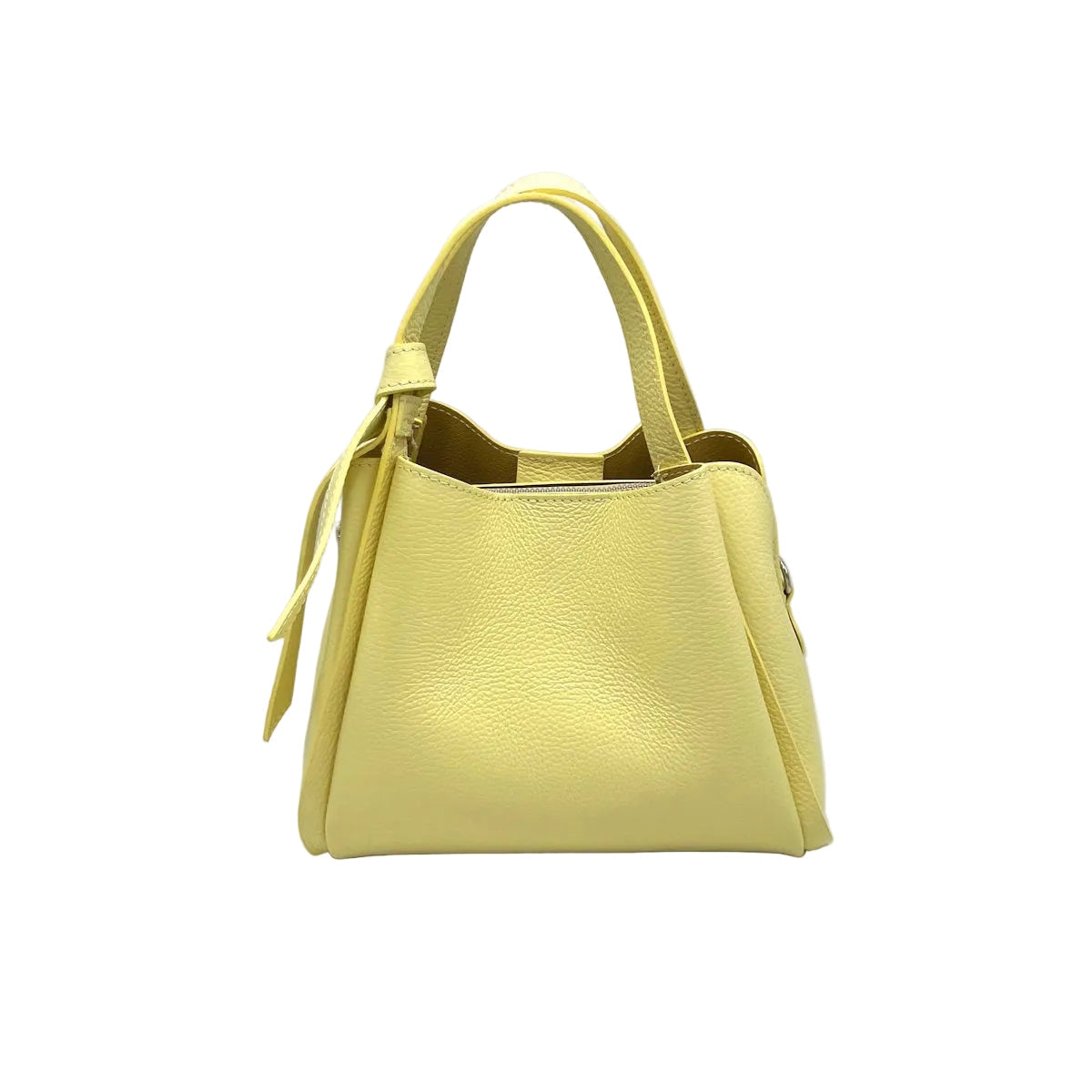 Pastel yellow Pienza handbag on a white background