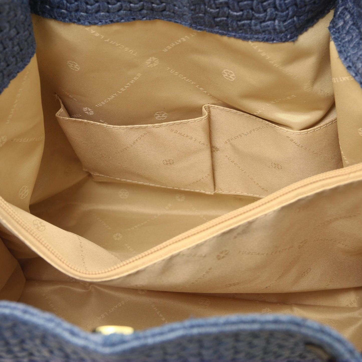 Inside view of TL KeyLuck woven printed leather shopping bag showing beige lining and two slip pockets.