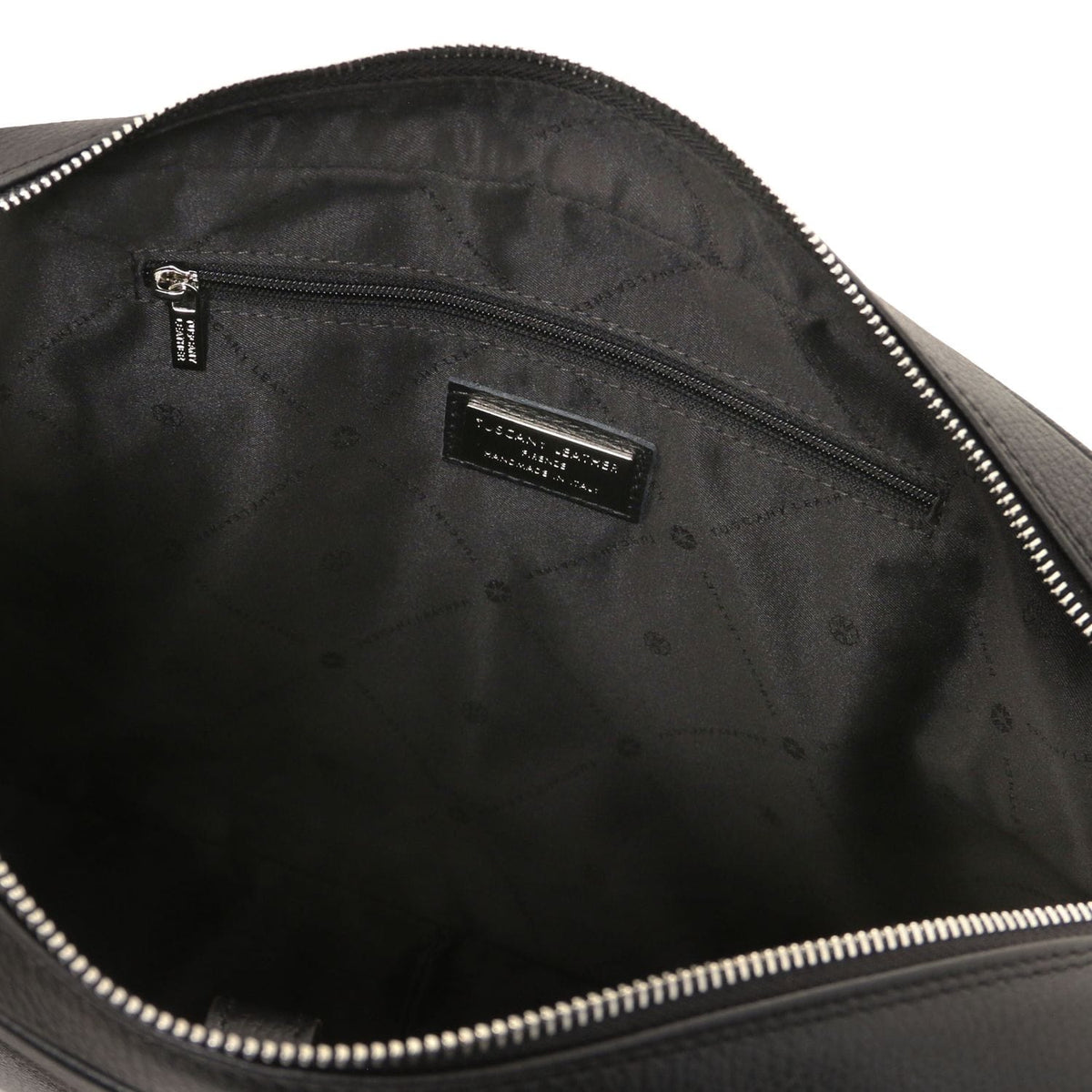 Vue intérieure of Treviso serviette pour ordinateur en cuir with poche zippée and brand plaque on black lining.