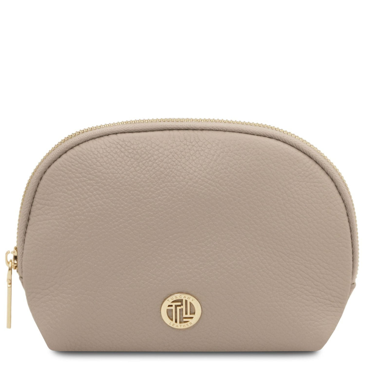 Soft taupe leather toiletry case with texture grainée, fermeture zippée dorée, and circular metal emblem on front panel.