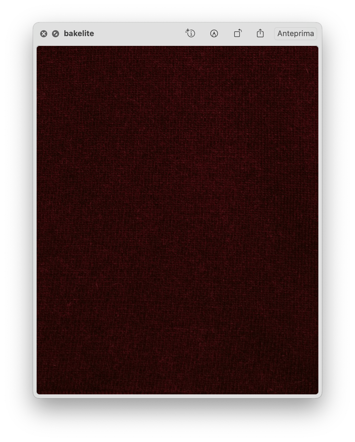 Close-up of deep burgundy fabric texture showing the fine knit and softness of the Wool & Cashmere Mix Solid Maxi Turtleneck Sweater.