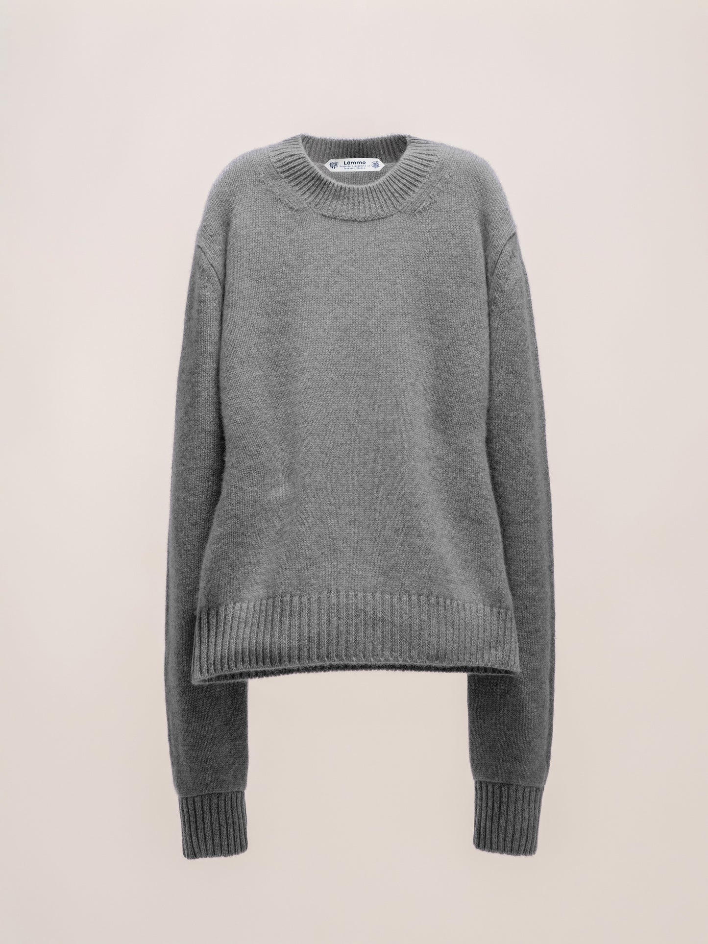 Gray sweater on a beige background