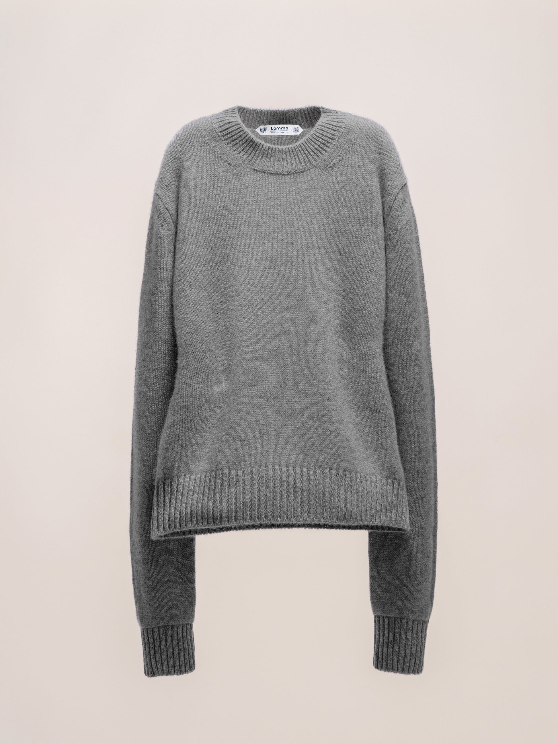 Gray sweater on a beige background