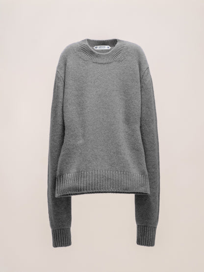 Gray sweater on a beige background