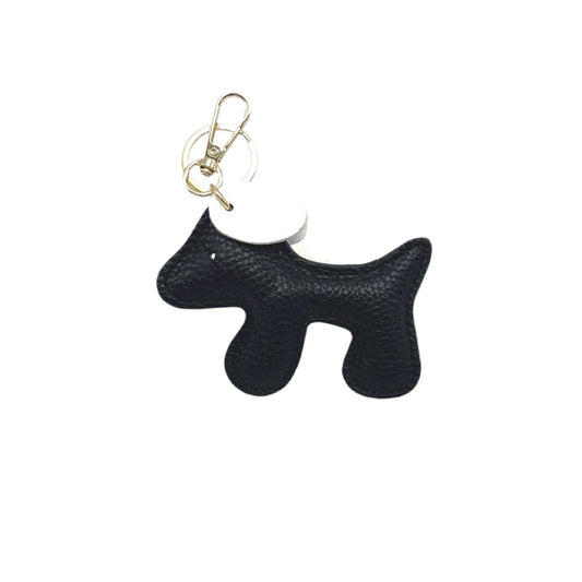 Black dog-shaped keychain on a white background