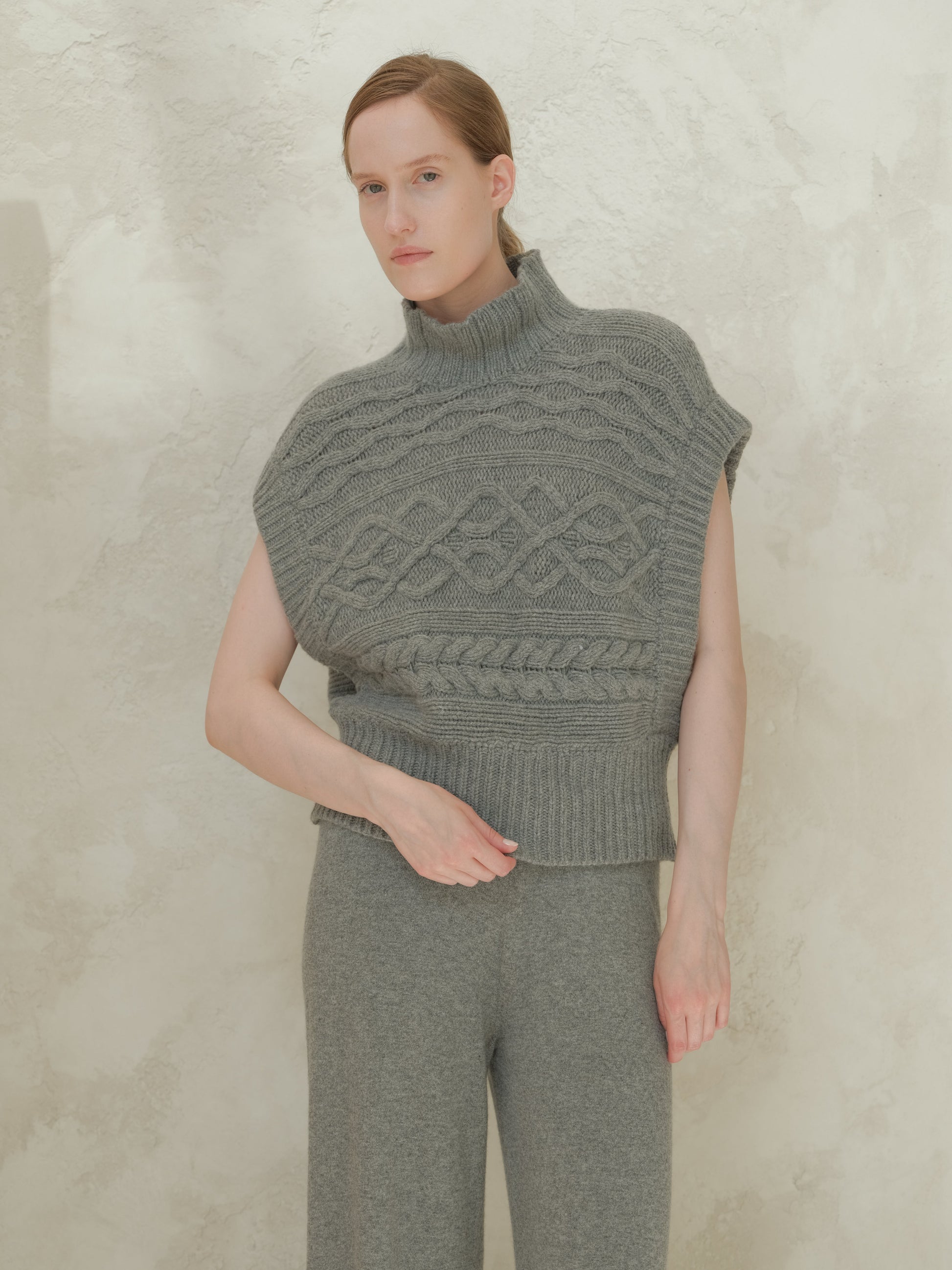 Gray cashmere mix maxi cable tunic with a tall ribbed neck and prominent cable knit across the chest