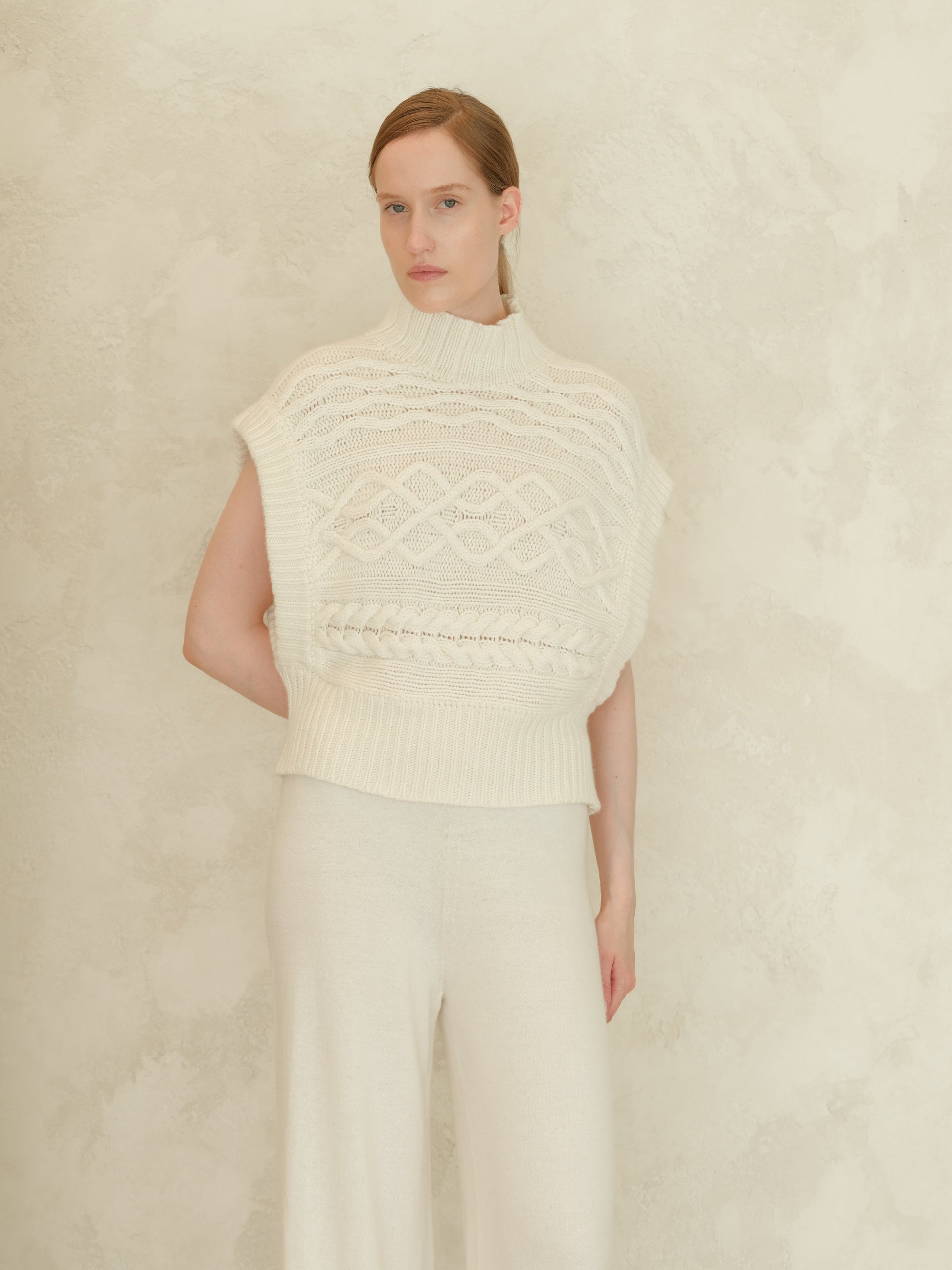 Cream Cashmere Mix Maxi Cable Tunic worn by a model with a high ribbed neck and chunky knit cable pattern.