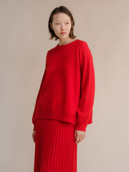 Bright red cashmere mix crewneck sweater with ribbed knit and relaxed silhouette with side slits at the hem