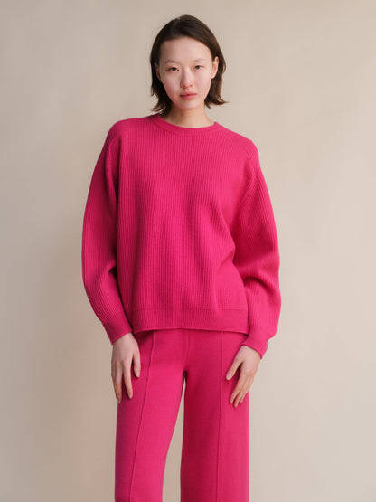 Bright pink cashmere mix ribbed crewneck sweater with side slits
