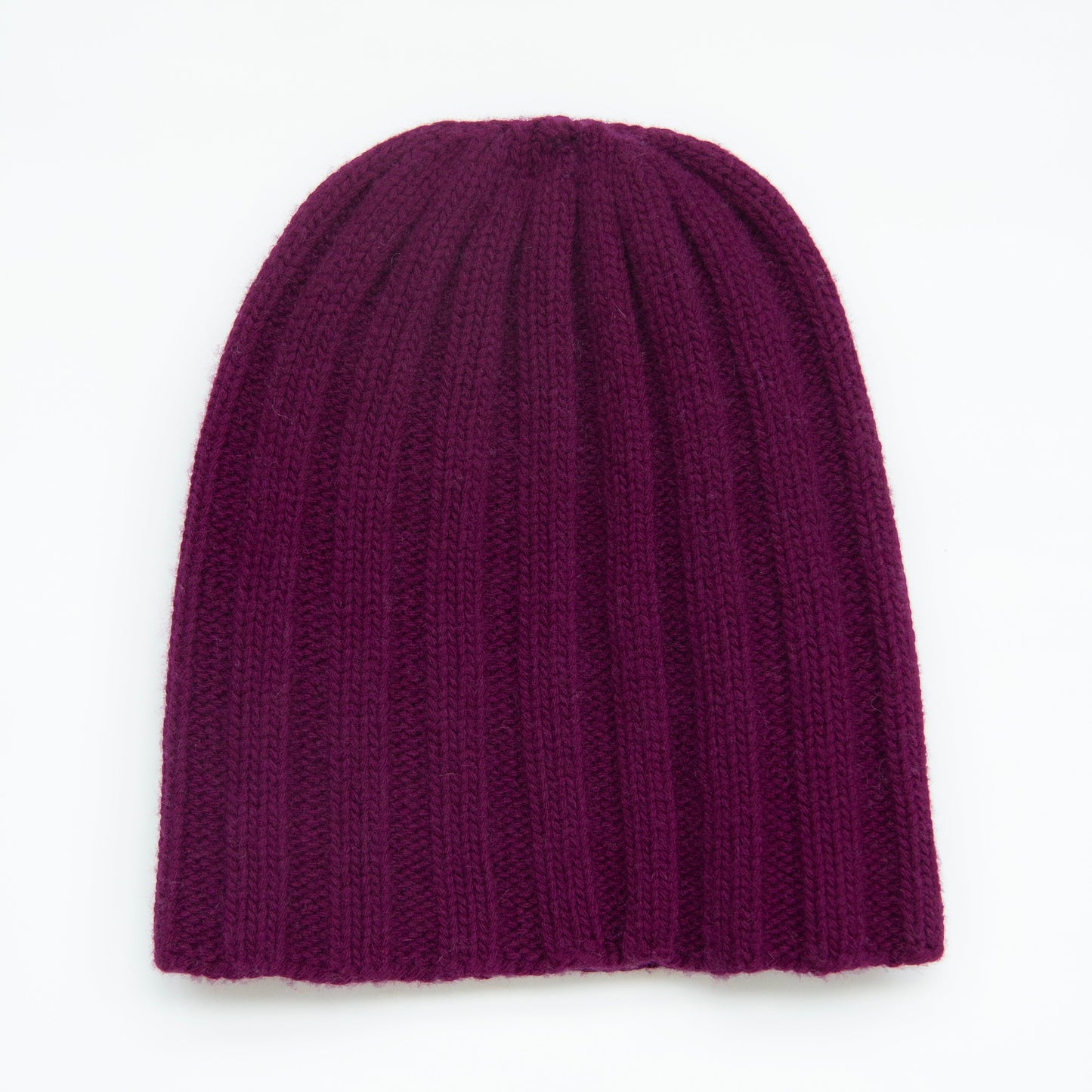 Purple knit beanie on a white background