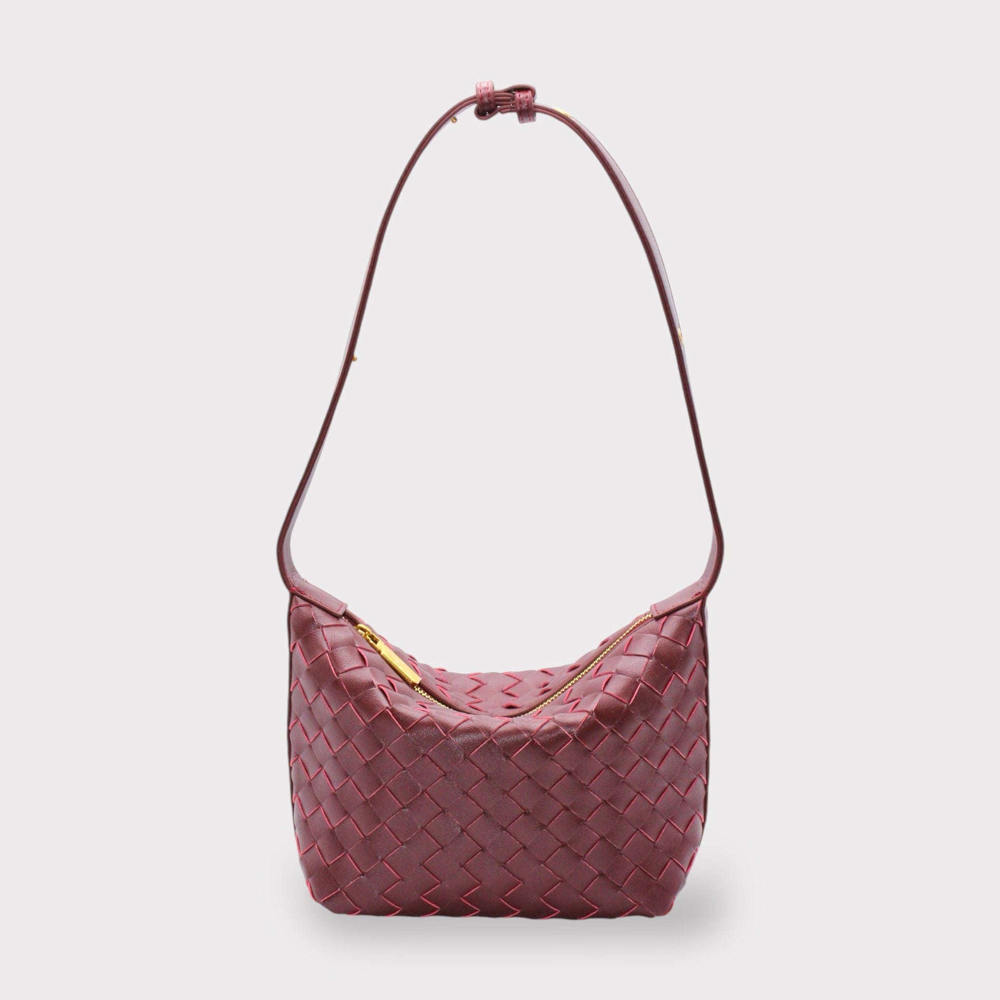 Genuine leather woven style boxed pouch bag in burgundy with a gold zipper and long shoulder strap