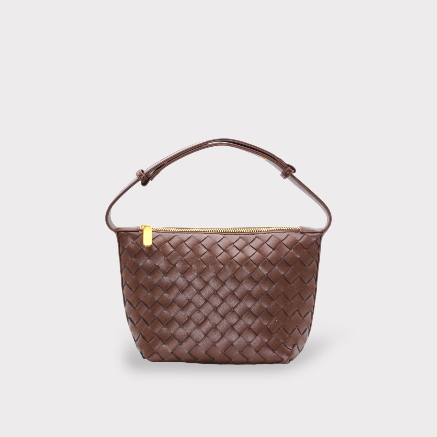 Genuine leather woven boxed pouch bag in brown with top gold zipper and a short handle.