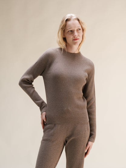 Model wearing taupe cashmere mix ribbed mock neck sweater