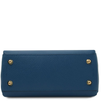 Bottom view of blue Abby leather shoulder bag with four gold studs