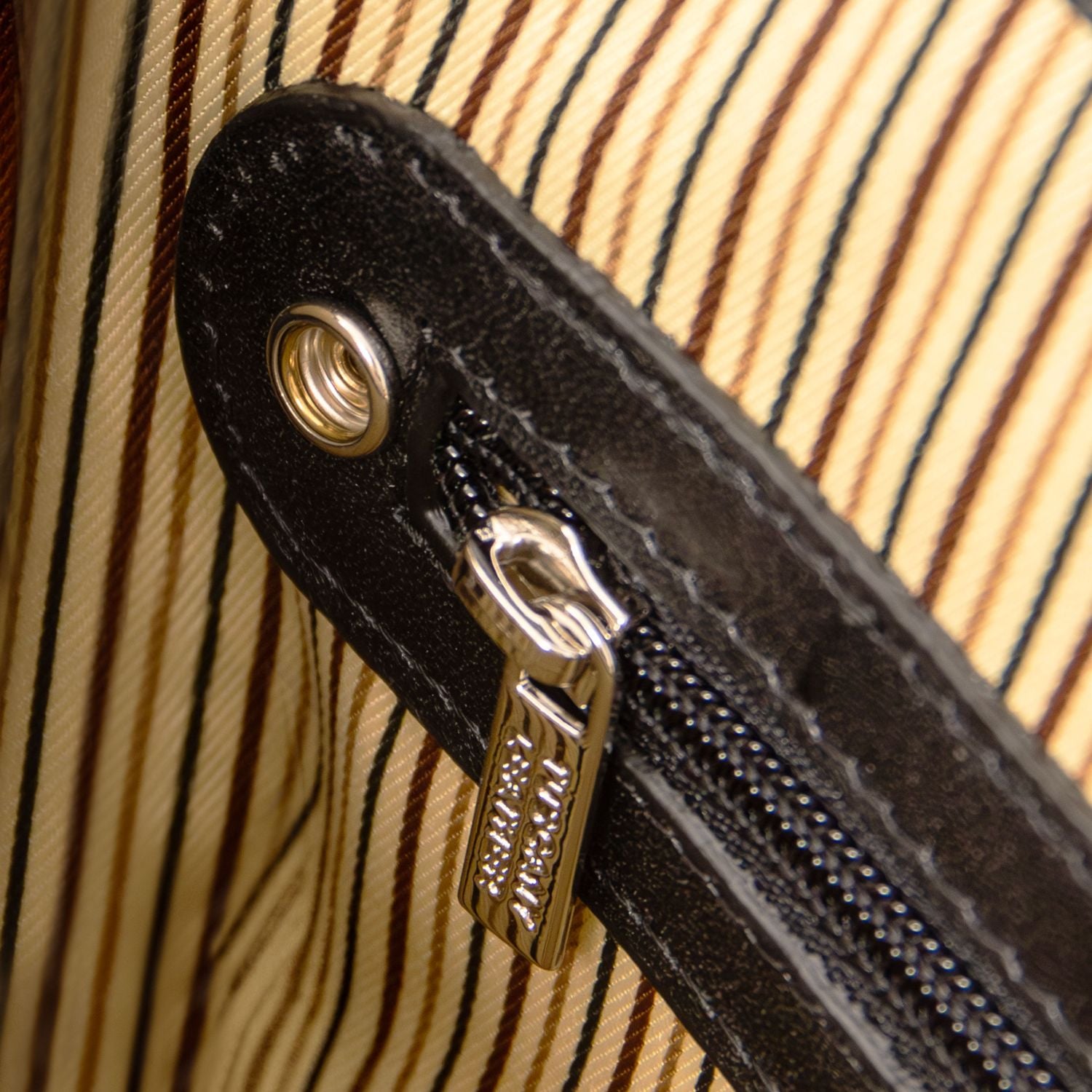 Close-up of matte black Alessandria laptop briefcase zipper and hardware