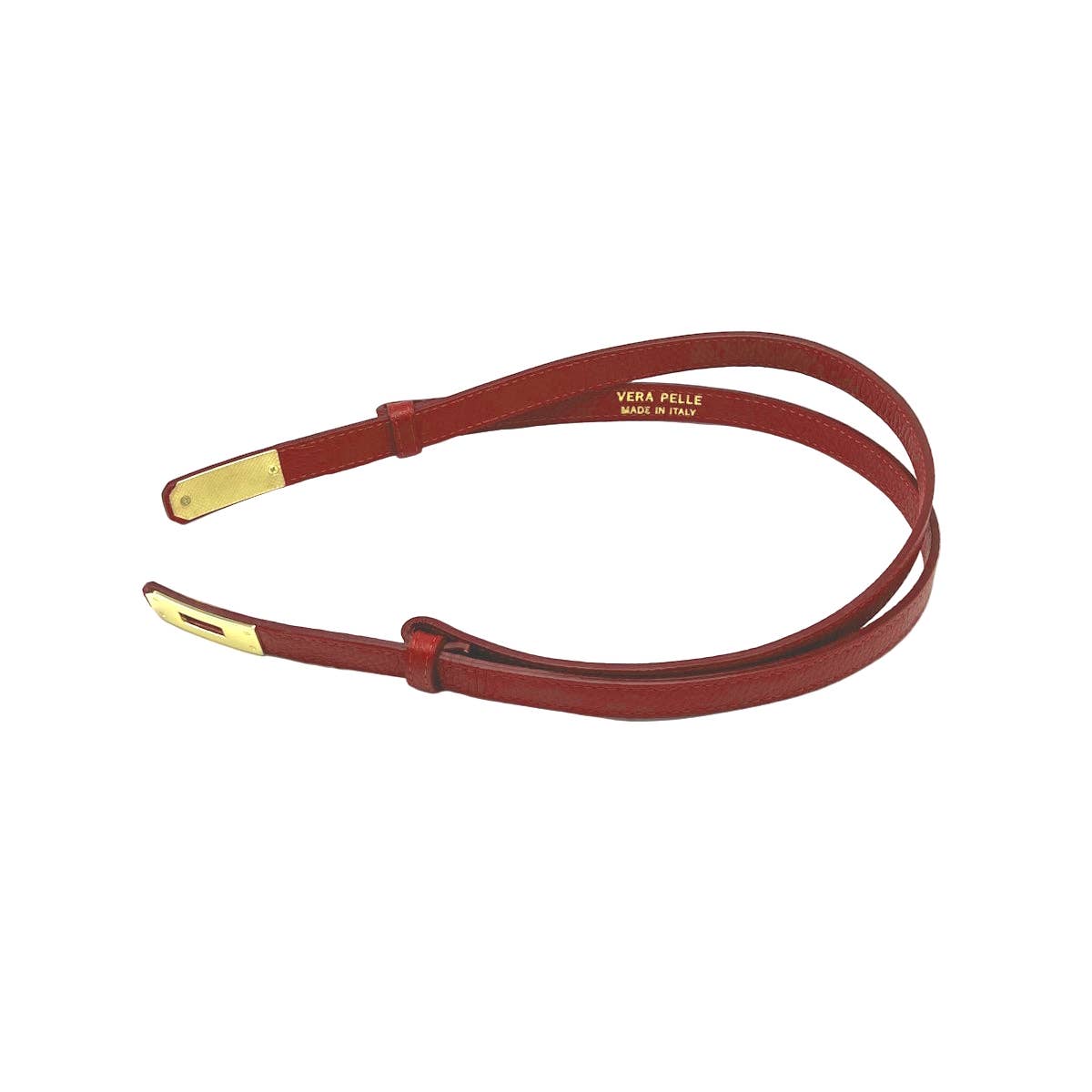 Red leather belt with gold hardware on a white background