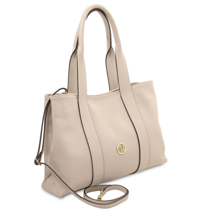Callie soft leather shoulder bag in light beige with dark edge piping and gold logo