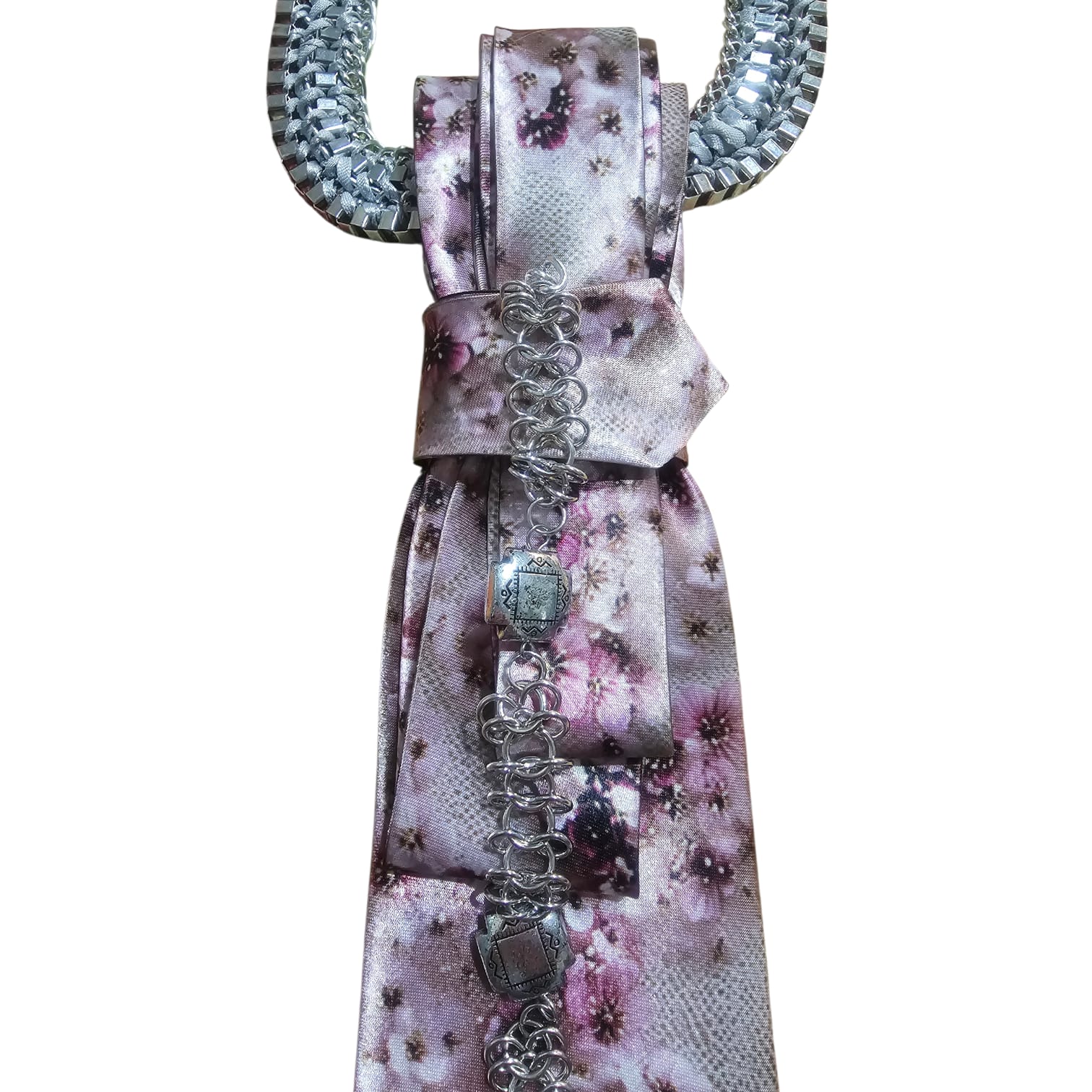 Close-up of Cherry Blossom 4-in-1 Jeweled Tie featuring a pink floral scarf and silver chain embellishment.