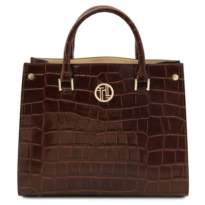 Croque - Croc print leather tote handbag | TL142504 in dark brown with glossy embossed texture, Tragegriffs, and goldfarbene Beschläge vor weissem Hintergrund