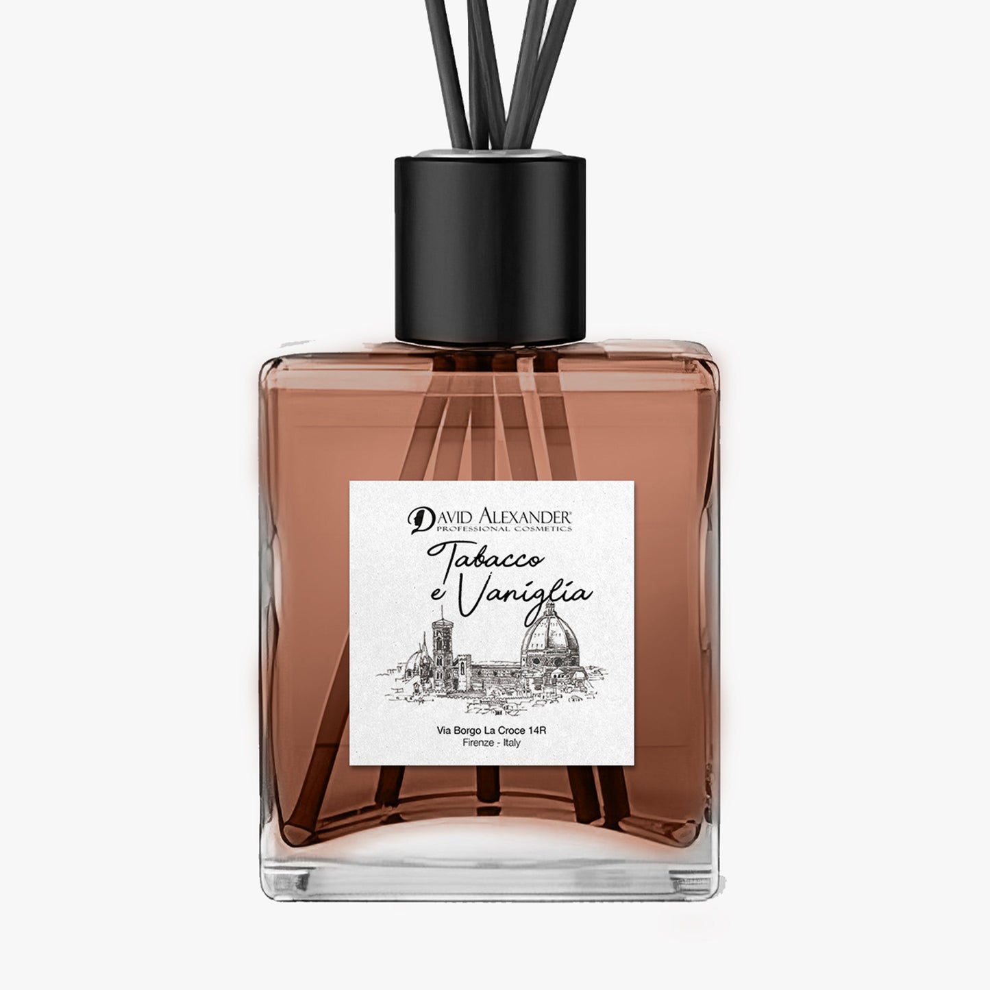 Tabacco e Vaniglia room diffuser in a square glass bottle with pink liquid, reeds and a black cap