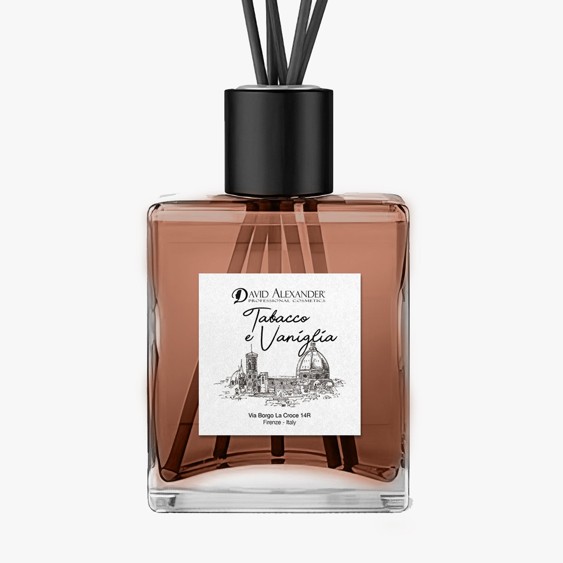 Tabacco e Vaniglia room diffuser in a square glass bottle with pink liquid, reeds and a black cap
