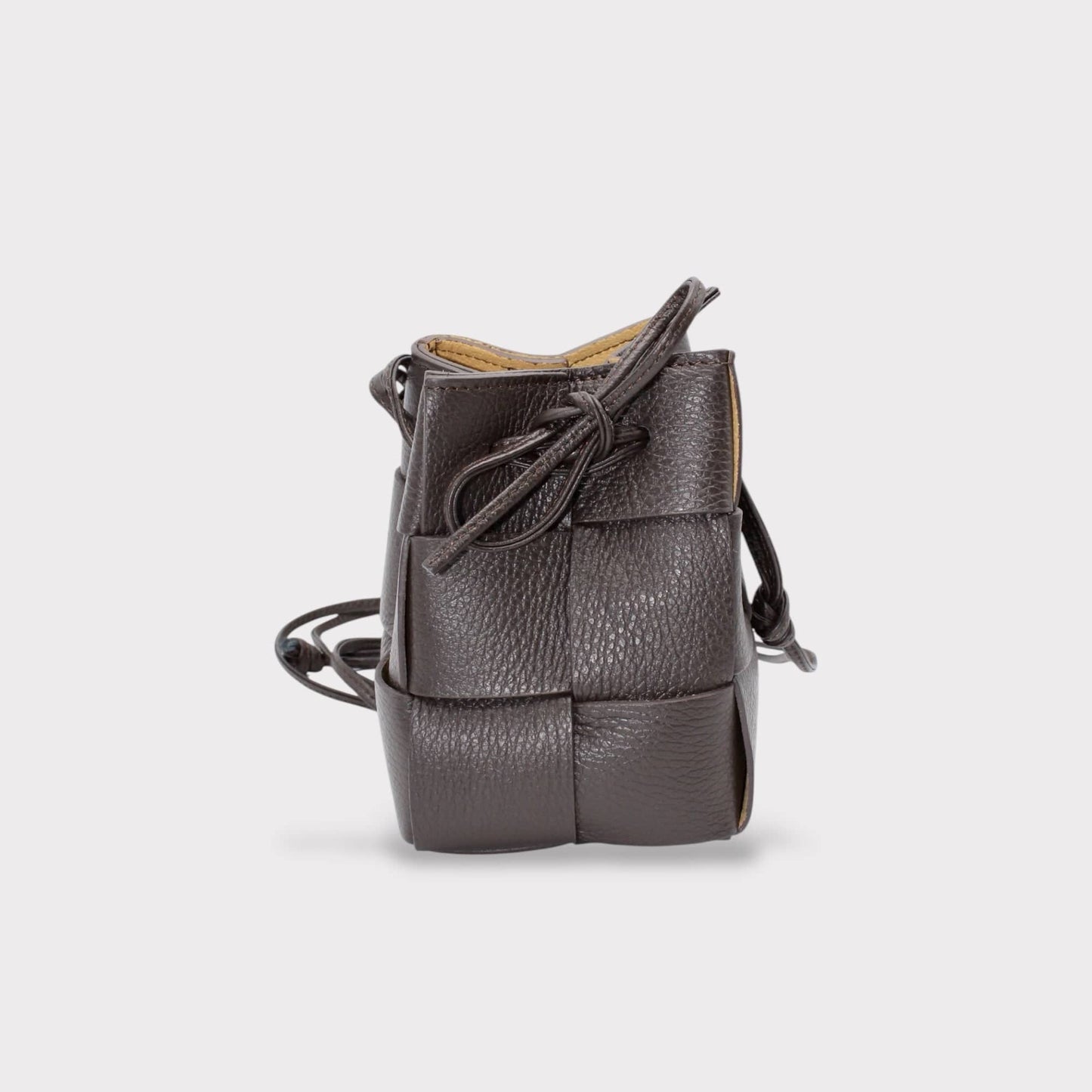 Emi handmade drawstring woven crossbody bag in dark gray with knotted front and long strap