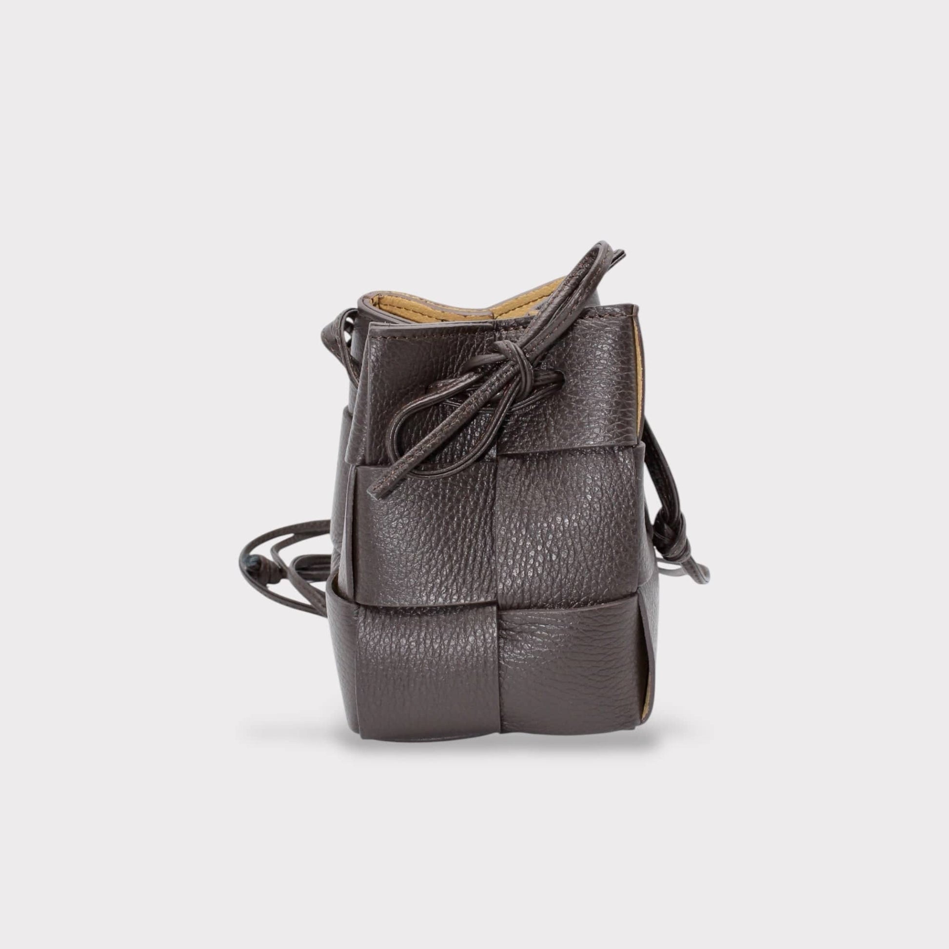 Emi handmade drawstring woven crossbody bag in dark gray with knotted front and long strap