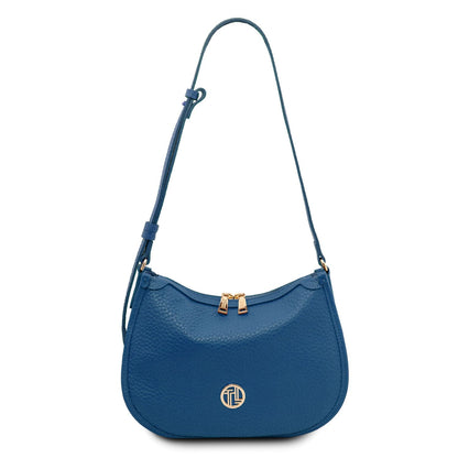 Blue soft leather Hoblò hobo bag with curved shape gold-tone hardware and long adjustable strap
