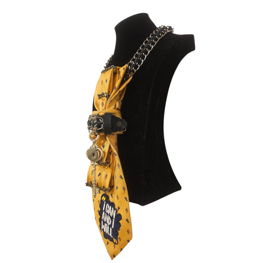 Side view of I can and I will 4-in-1 Jeweled Tie on a black display bust with a bold chain detail