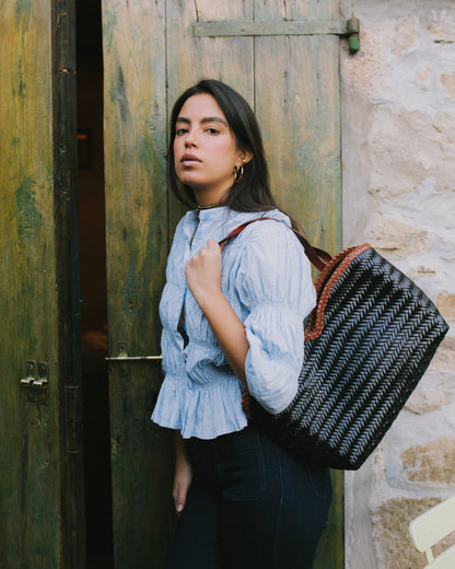 Léafa - Handwoven Leather Shoulder Bag | Brown & Black featuring a large woven leather body with braided brown leather handles.