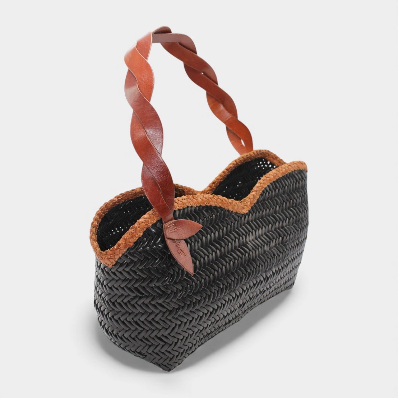 Léafa - Handwoven Leather Shoulder Bag | Brown & Black featuring black woven leather with brown scalloped trim and twisted braided leather handles.