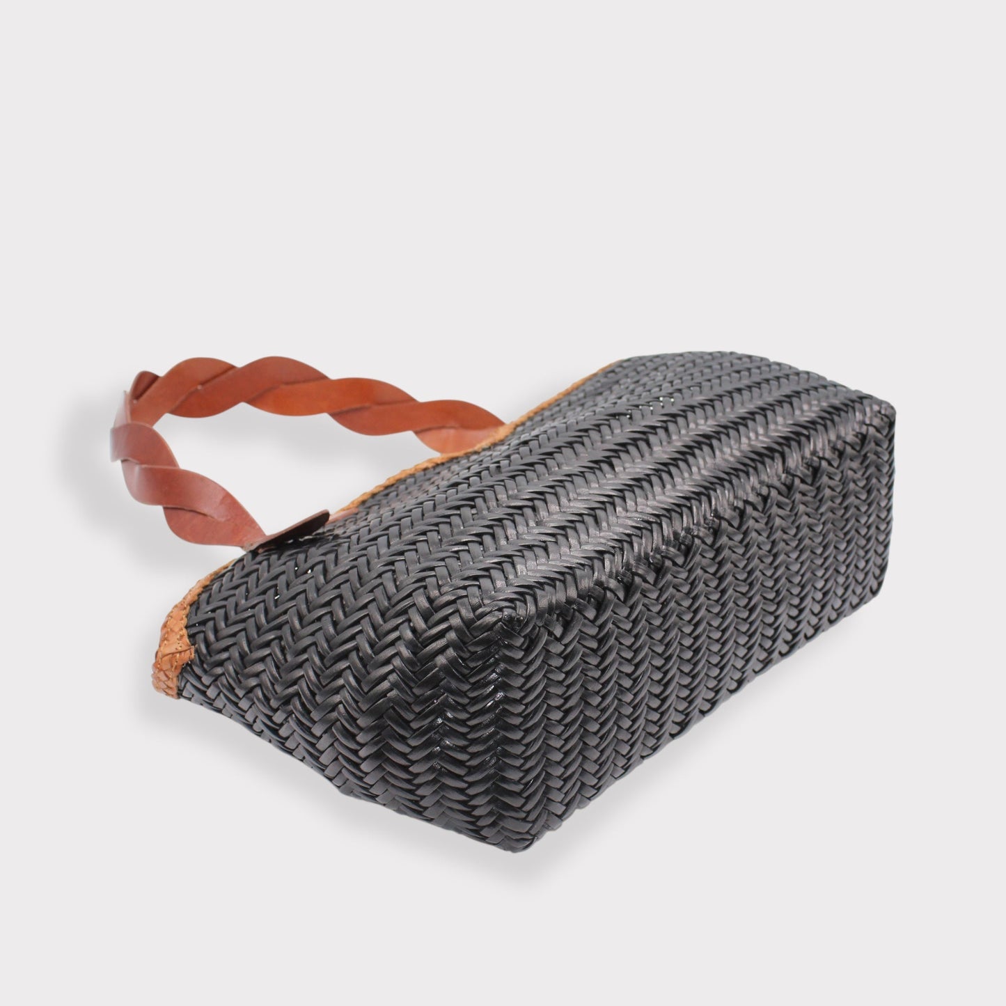 Léafa - Handwoven Leather Shoulder Bag | Brown & Black showing textured woven leather base with braided brown leather handles on light background.