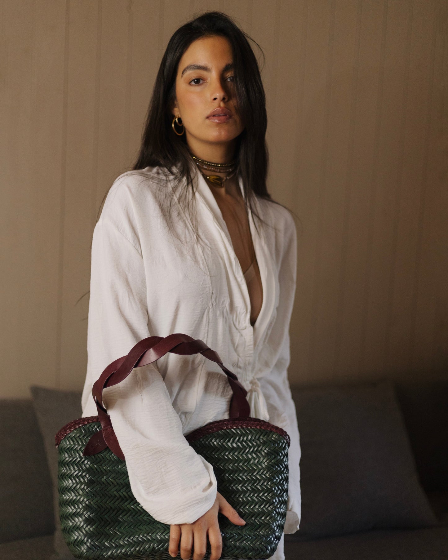 Léafa - Handwoven Leather Shoulder Bag | Burgundy & Green featuring braided burgundy leather handles and woven green leather body against neutral background.