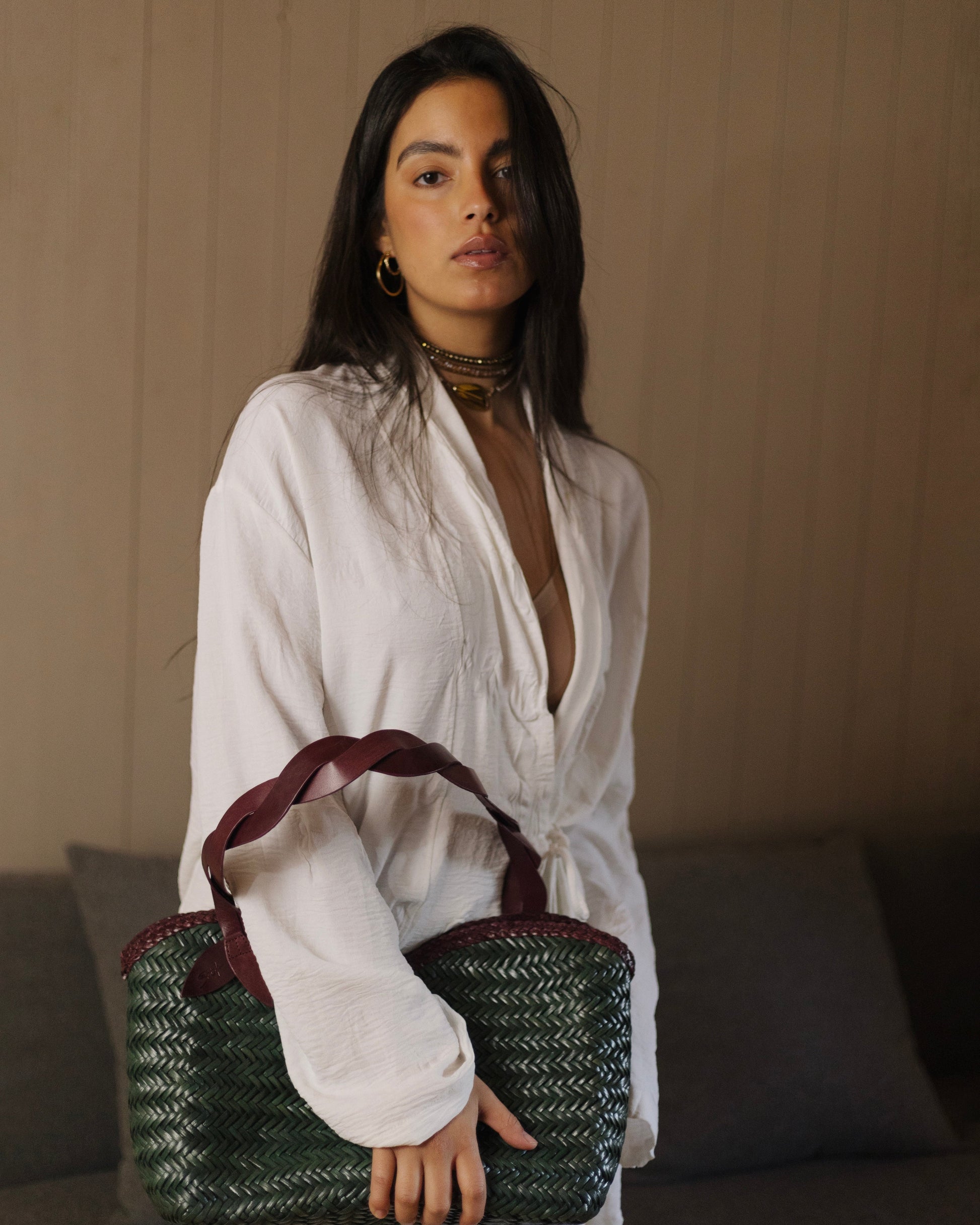 Léafa - Handwoven Leather Shoulder Bag | Burgundy & Green featuring braided burgundy leather handles and woven green leather body against neutral background.