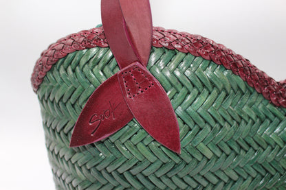 Léafa - Handwoven Leather Shoulder Bag | Burgundy & Green close-up of woven leather texture with burgundy trim and green leather body detail.