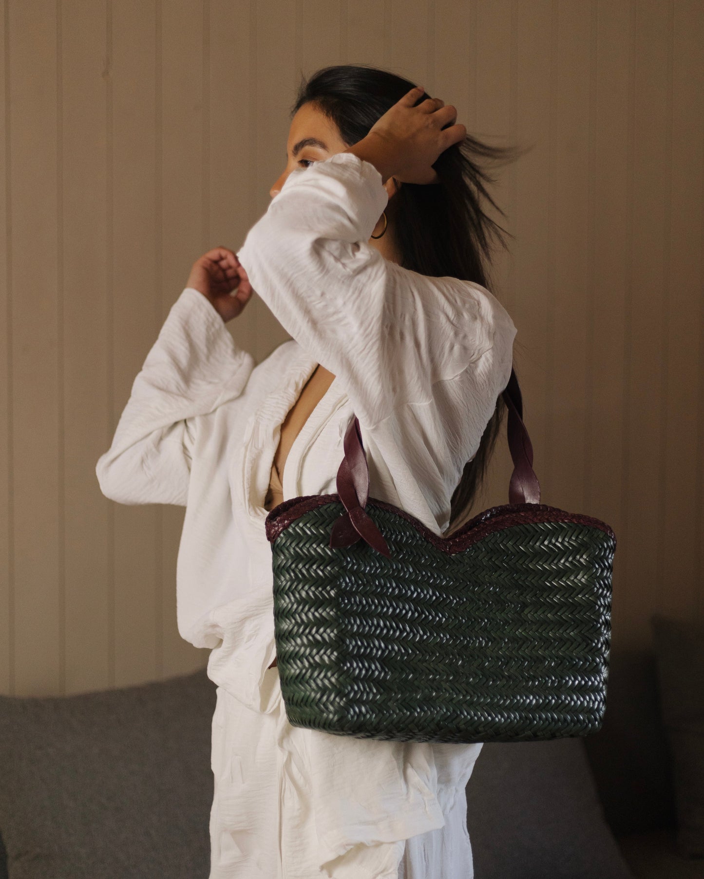 Léafa - Handwoven Leather Shoulder Bag | Burgundy & Green featuring woven green leather body with burgundy braided trim and burgundy leather handles.