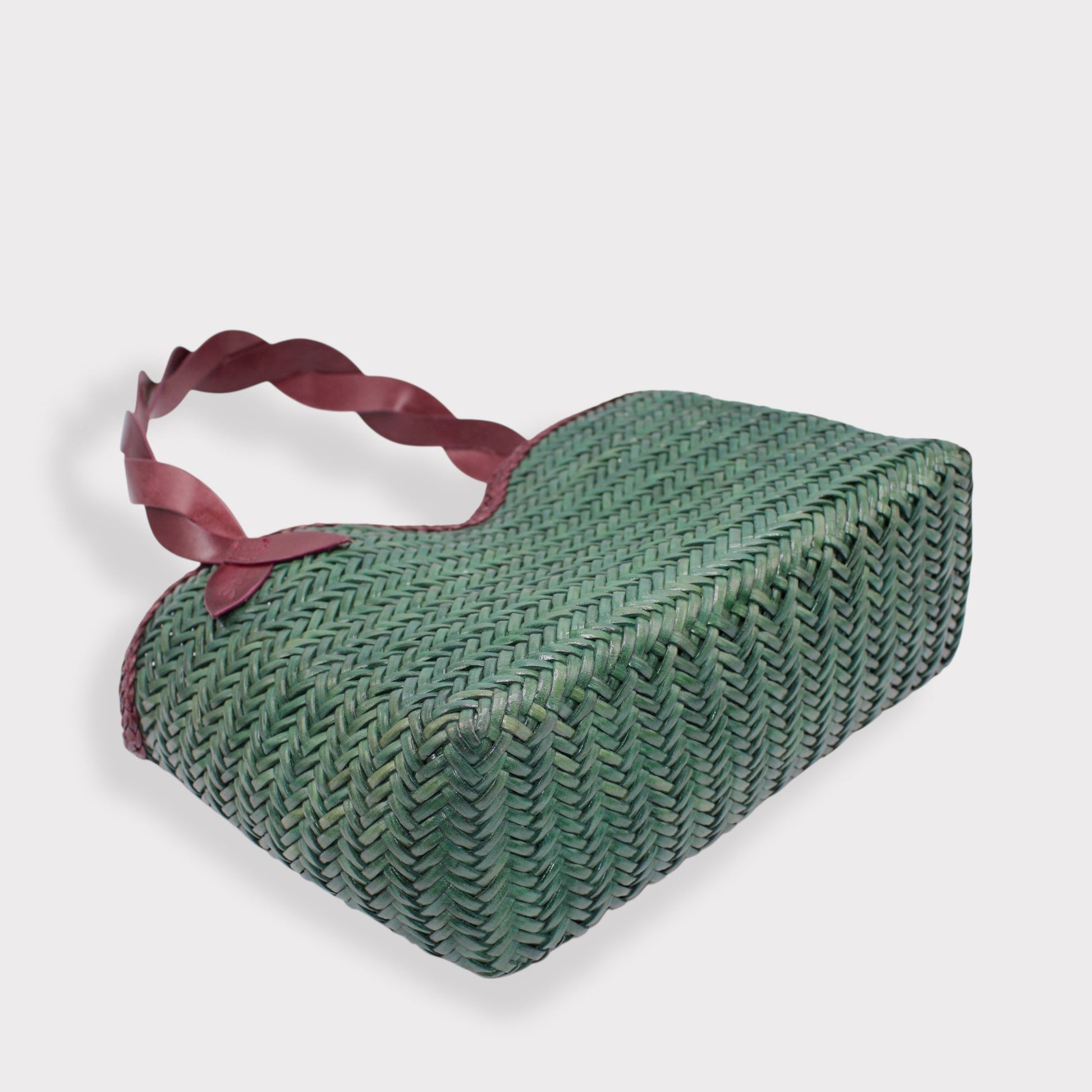 Léafa - Handwoven Leather Shoulder Bag | Burgundy & Green featuring woven green leather body with burgundy twisted leather handles and smooth trim.