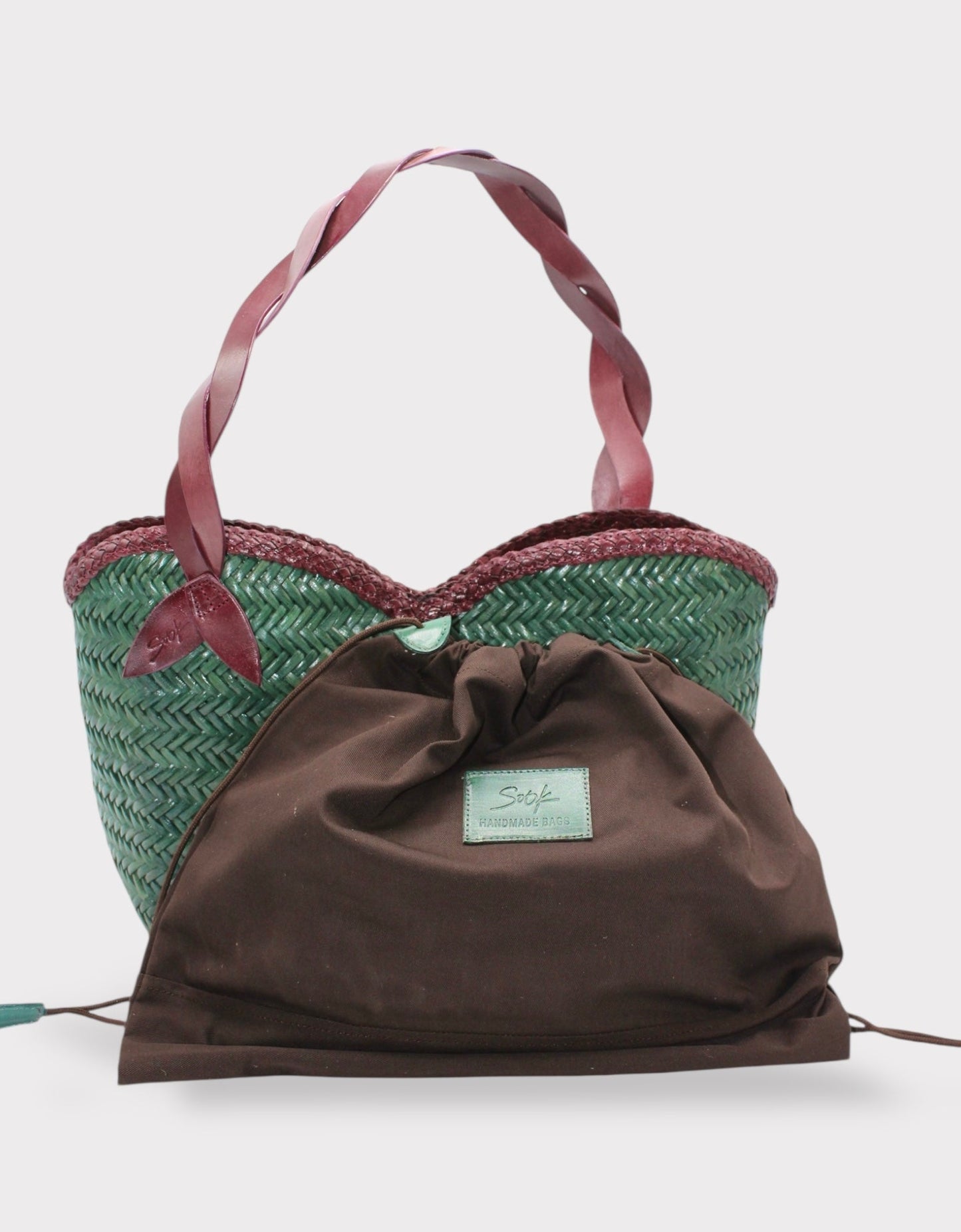 Léafa - Handwoven Leather Shoulder Bag | Burgundy & Green with twisted leather handles and woven texture in green and burgundy tones.